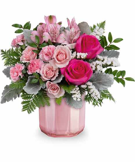 hot pink and pastel pink flowers in a light pink striped container