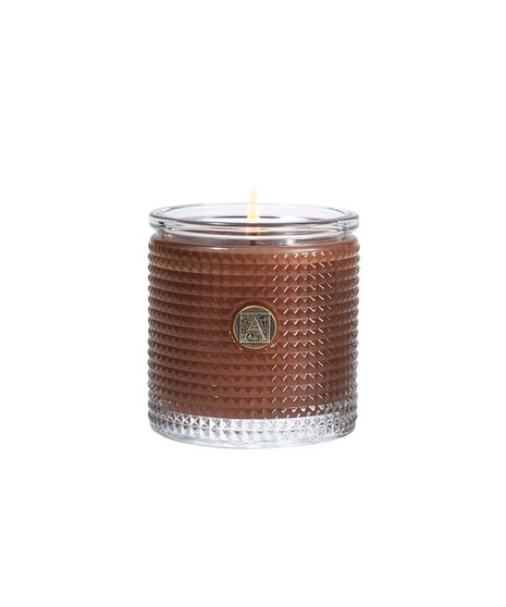 colored aromatic candle on a neutral white background