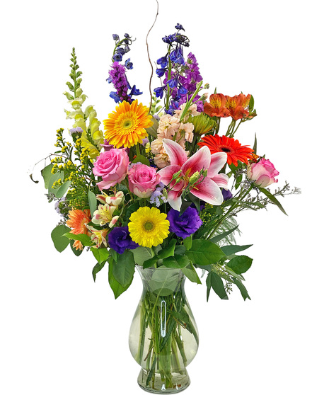 Alstroemeria, chrysanthemums, roses, gerberas and snapdragons are delivered in a stylish glass vase.