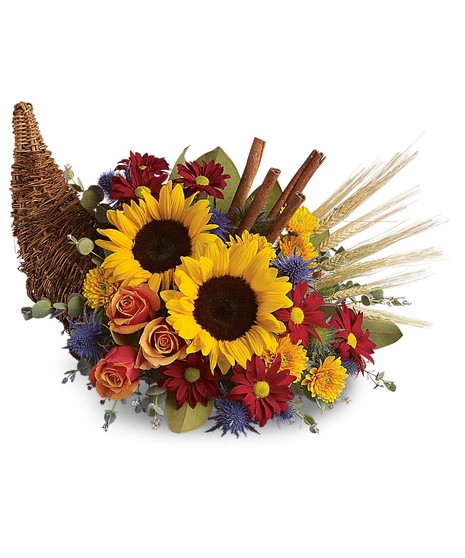 fall toned flowers in a cornucopia