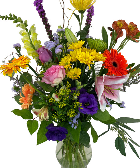 Alstroemeria, chrysanthemums, roses, gerberas and snapdragons are delivered in a stylish glass vase.